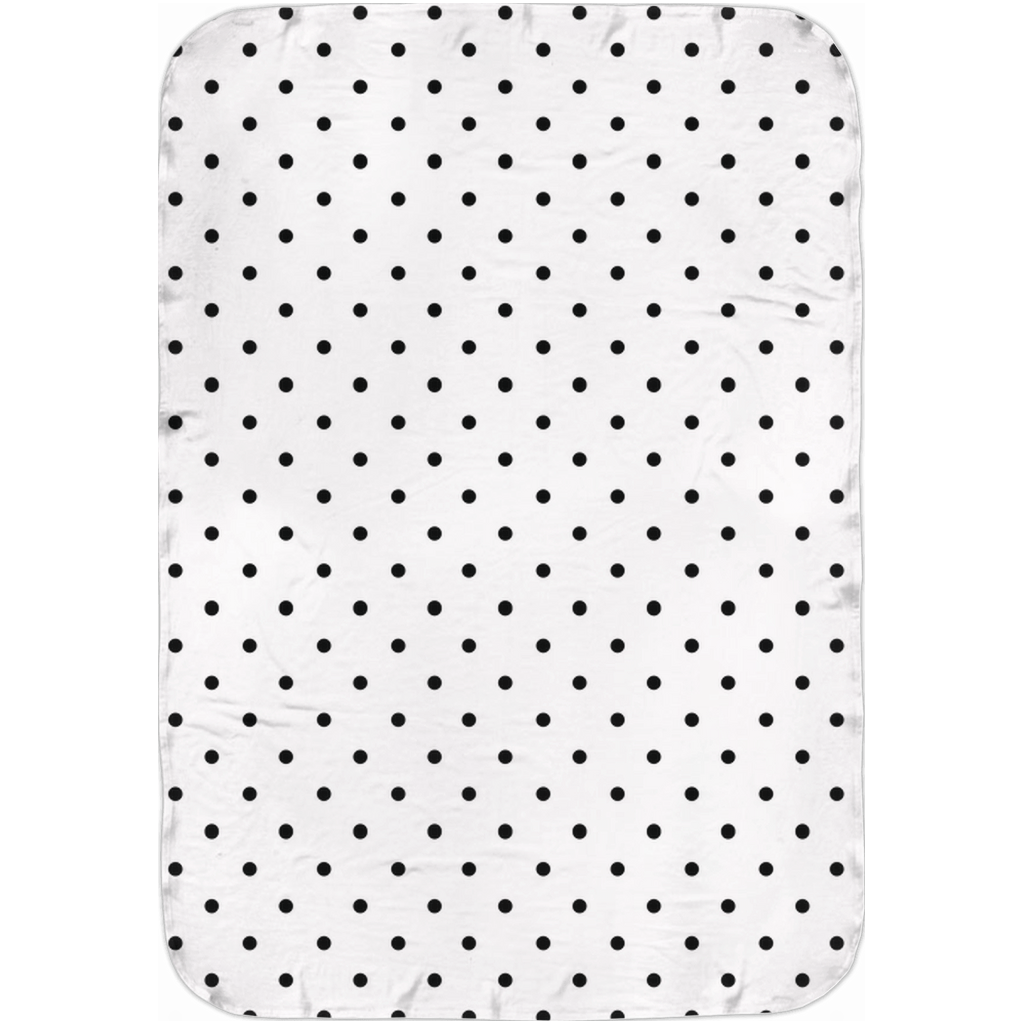 Folded black and white polka dot baby swaddle blanket.